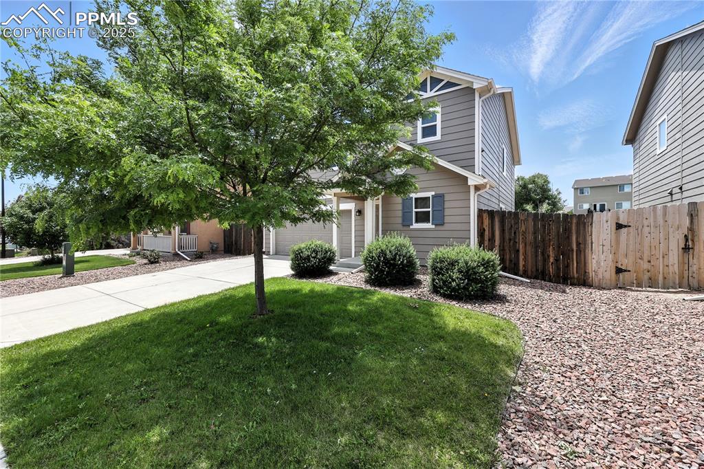 Image 46 of 46: Obstructed view of property featuring driveway