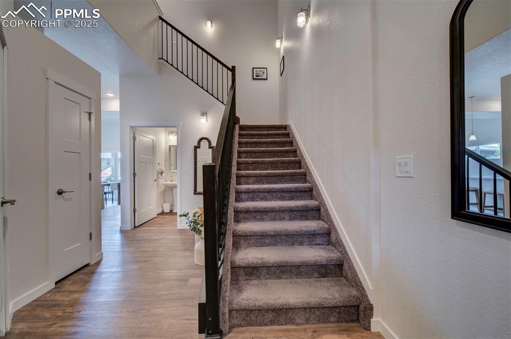 Image 2 of 42: Two-story entry with open railing.