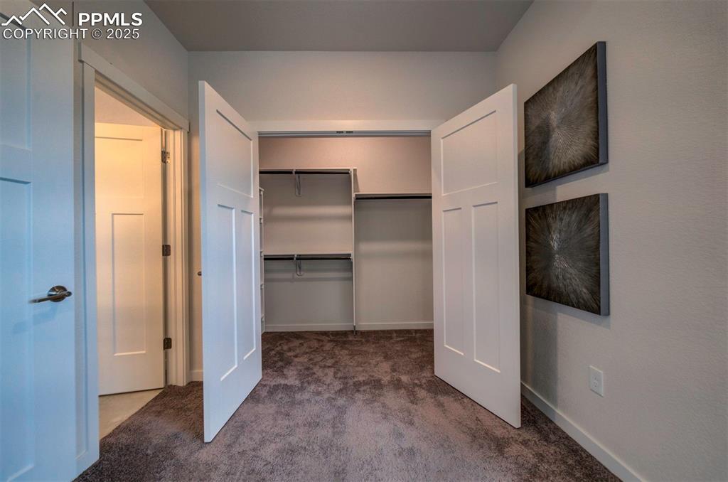Image 27 of 42: Primary bedroom has two closets. This is closet one.