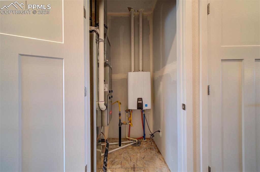 Image 39 of 42: High efficiency gas furnace and tankless gas water heater serve the home.
