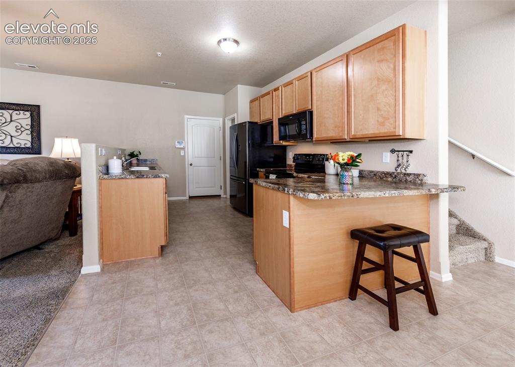 Image 6 of 36: Kitchen and garage entry