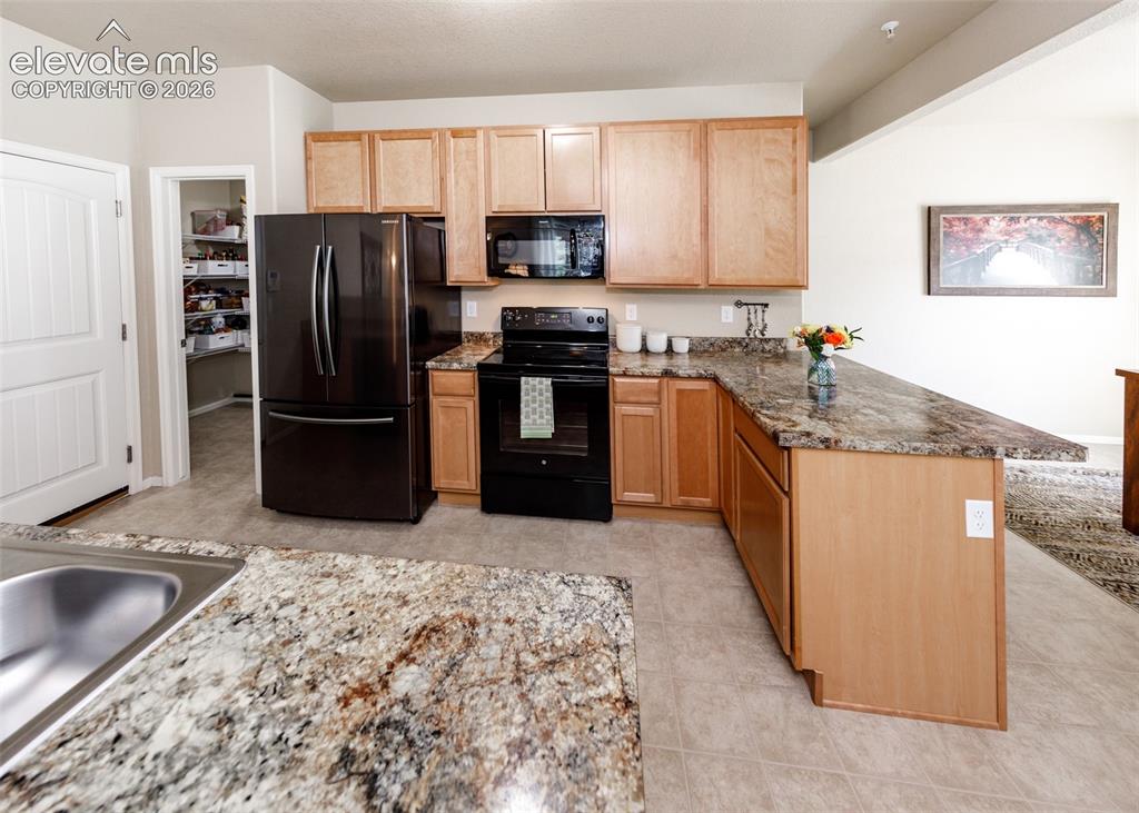 Image 8 of 36: Kitchen and dining room