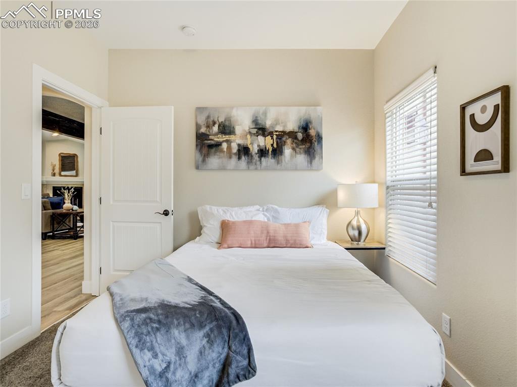 Image 20 of 47: Main level bedroom provides multi-generational space, or a perfect private 