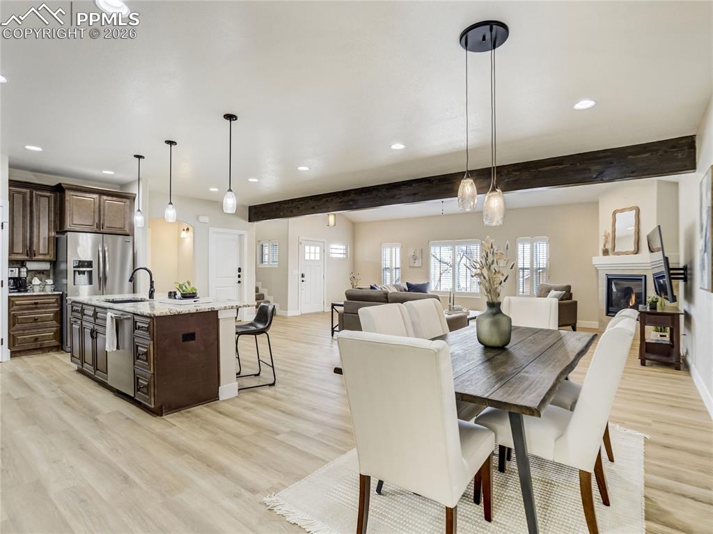 Image 7 of 47: Open dining area seamlessly connected to the kitchen and great room.