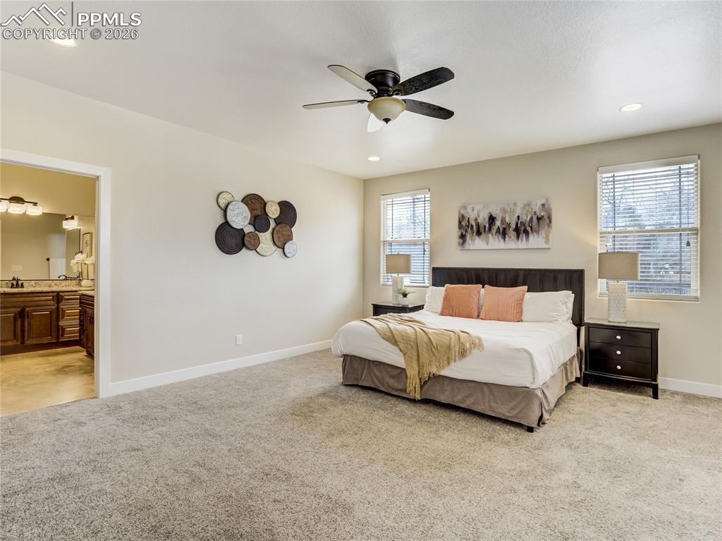 Image 8 of 47: Spacious primary suite with abundant natural light and private en-suite bat