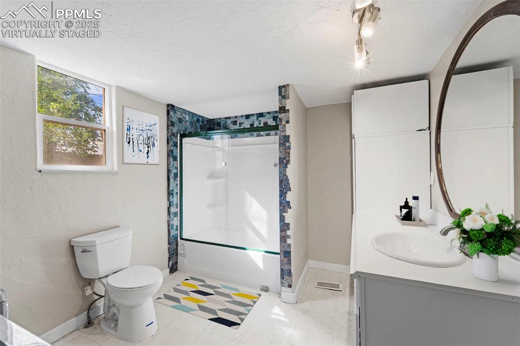 Image 14 of 35: Virtually Staged / Bathroom with updated hardware and spa-like details.