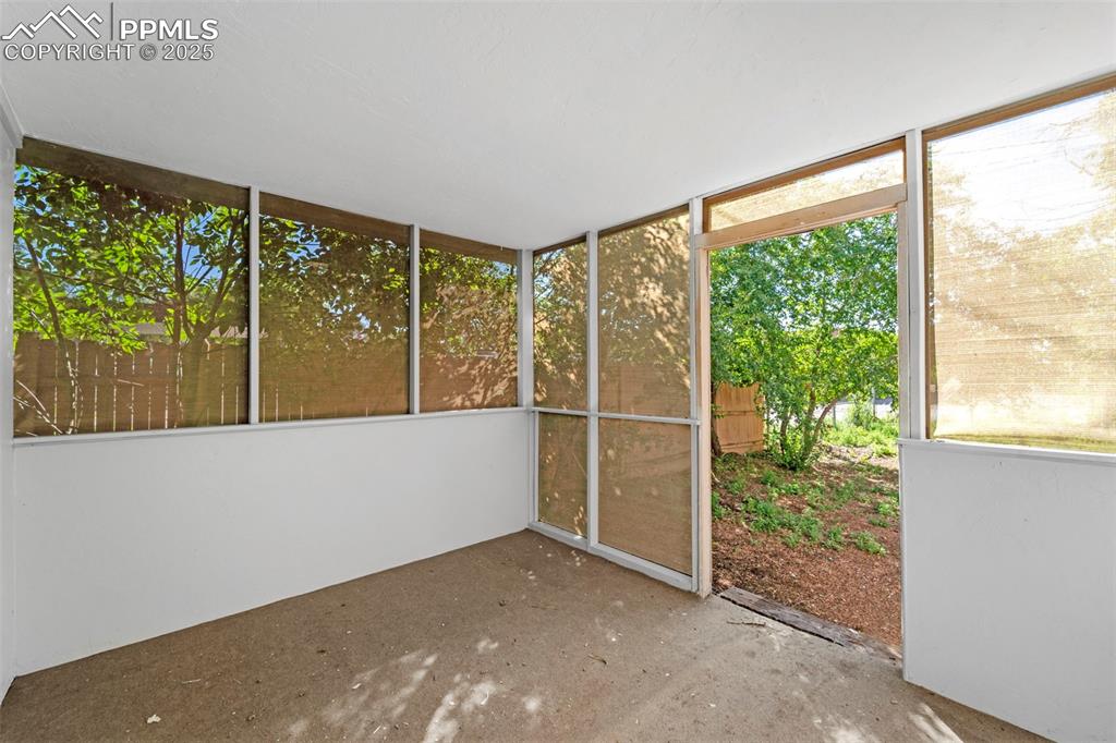 Image 26 of 35: Charming sunroom with full windows—perfect for year-round enjoyment.