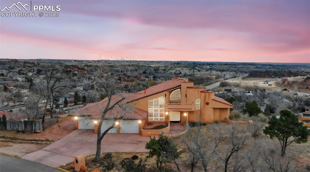 Caption: View of front of home featuring stucco siding