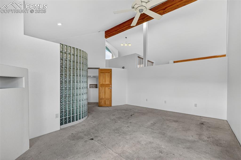 Image 24 of 50: primary bedroom with primary bathroom