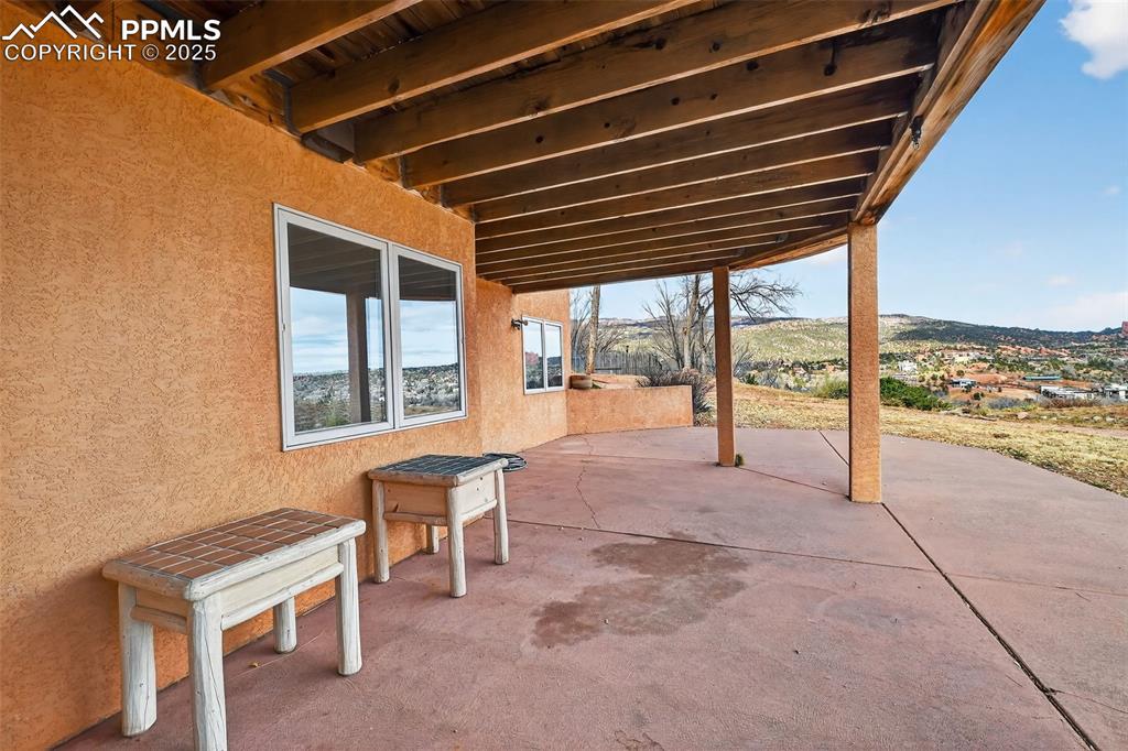 Image 37 of 50: View of patio featuring a mountain view