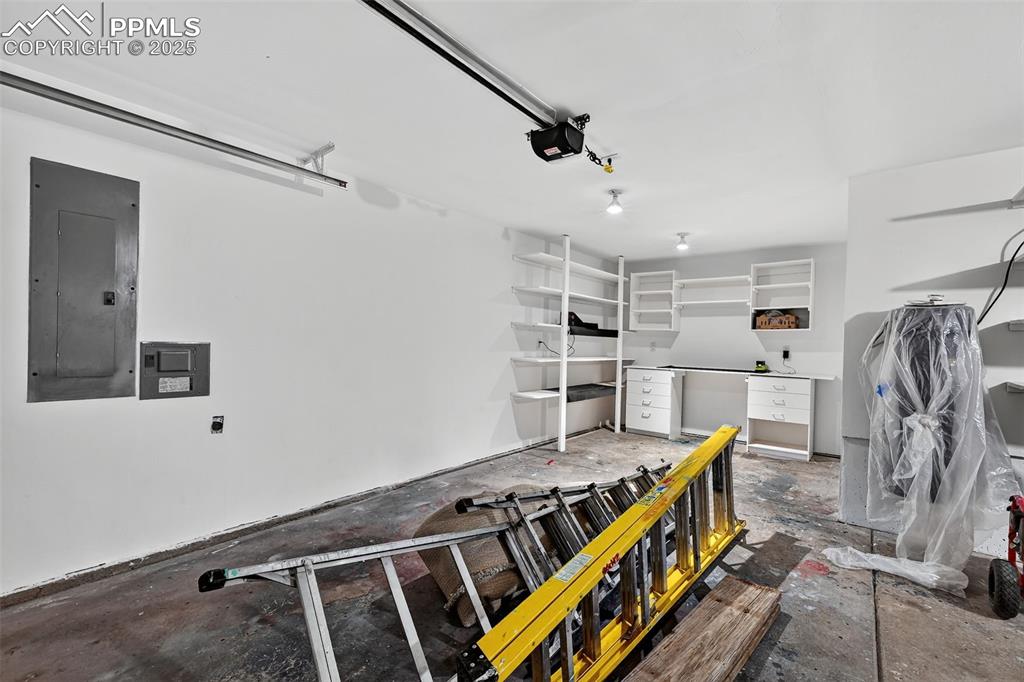 Image 46 of 50: Garage is three stall oversized