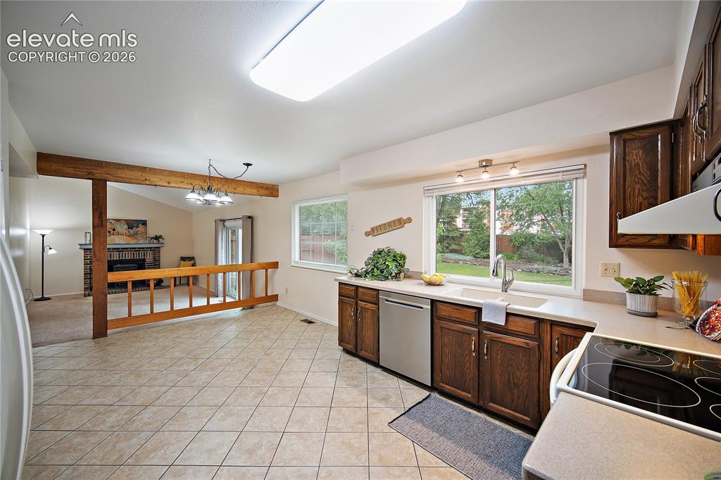 Image 10 of 42: Spacious eat in kitchen, open to the family room with walk out to back yard