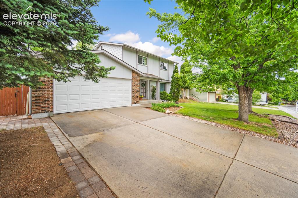 Image 2 of 42: Mature landscaping and well kept yard. 