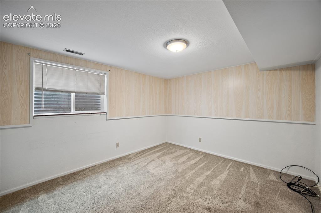 Image 20 of 42: Basement bedroom. 