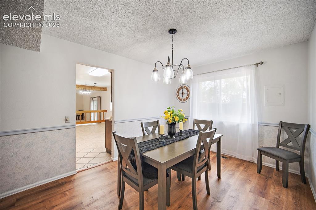 Image 8 of 42: Formal dining room perfect for entertaining