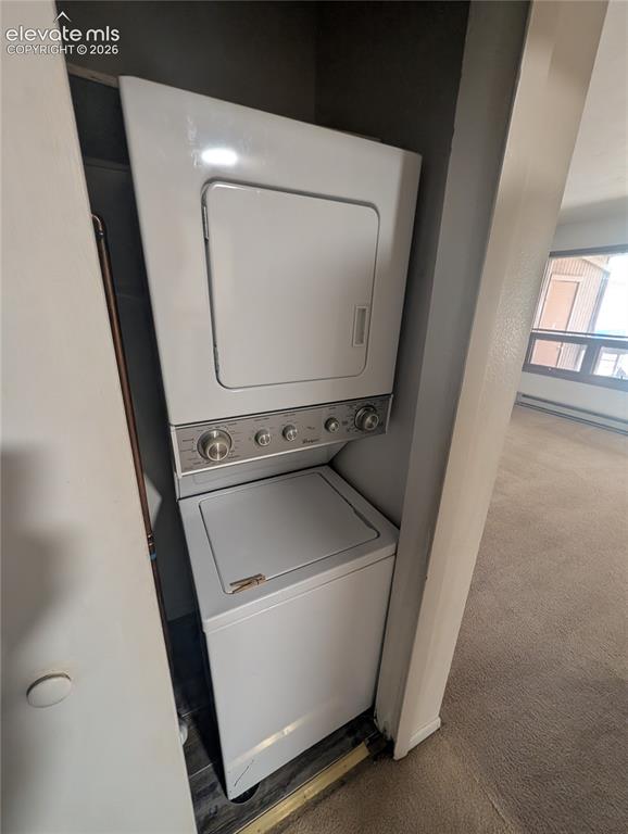 Image 21 of 30: White stackable washer and dryer unit