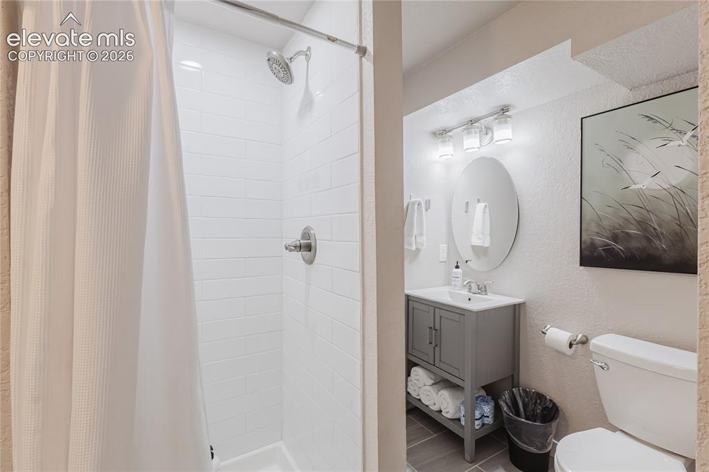 Image 34 of 49: Bathroom in lower level