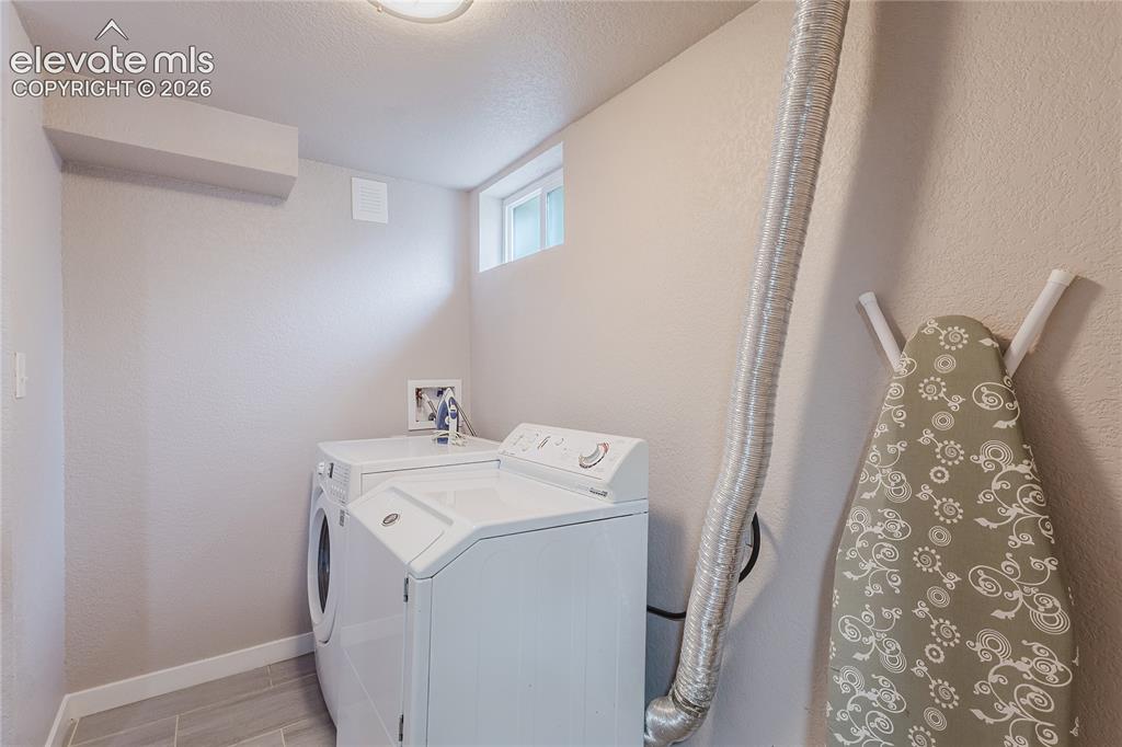 Image 36 of 49: Laundry in lower level