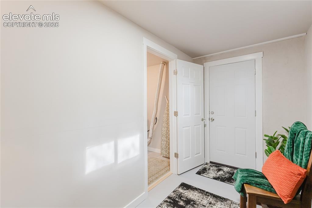 Image 38 of 49: Storage room and walkout to the