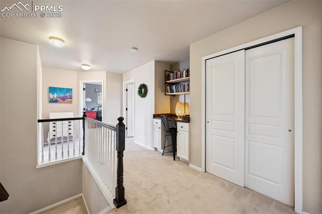 Image 21 of 40: Corridor with an upstairs landing