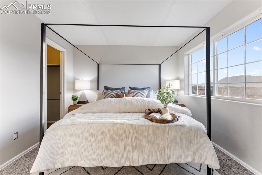 Image 15 of 45: Bedroom with baseboards and carpet flooring