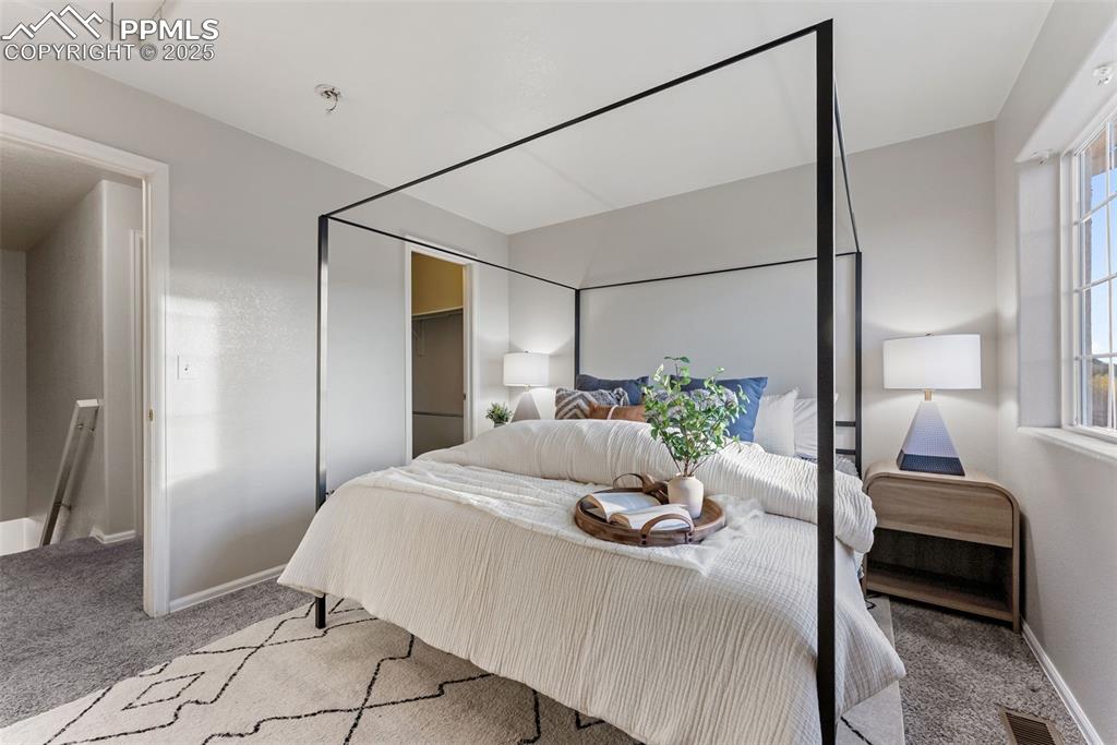 Image 17 of 45: Carpeted bedroom with baseboards