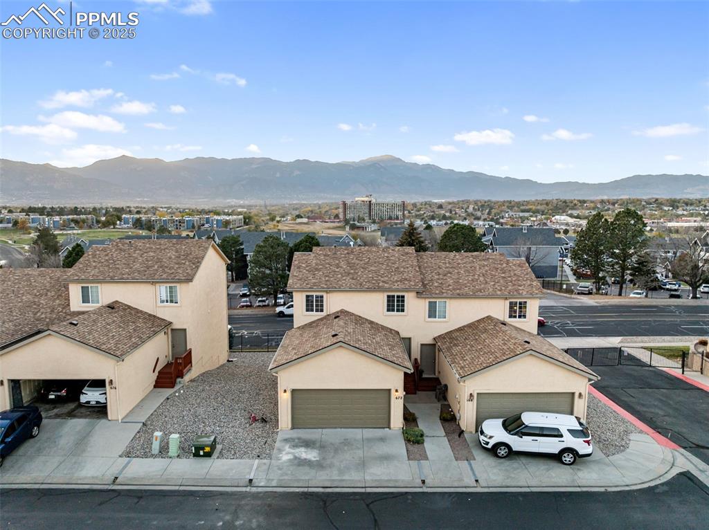 Image 38 of 45: View of mountain background with nearby suburban area