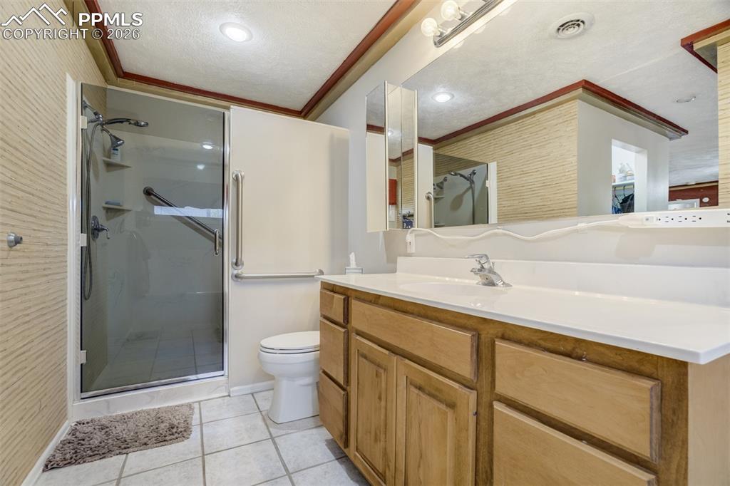 Image 19 of 50: Bathroom attached to primary bedroom