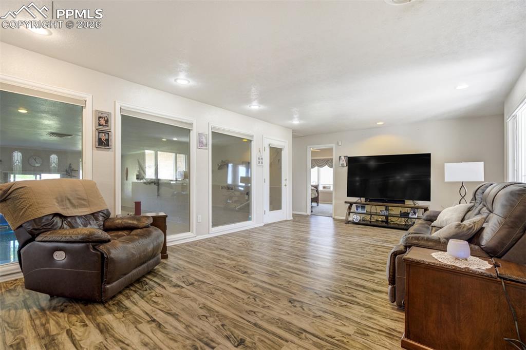 Image 7 of 50: Living room featuring heated floors