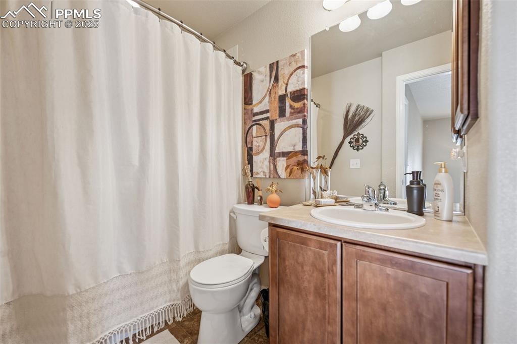Image 16 of 20: Full upstairs bathroom with shower and tub combo