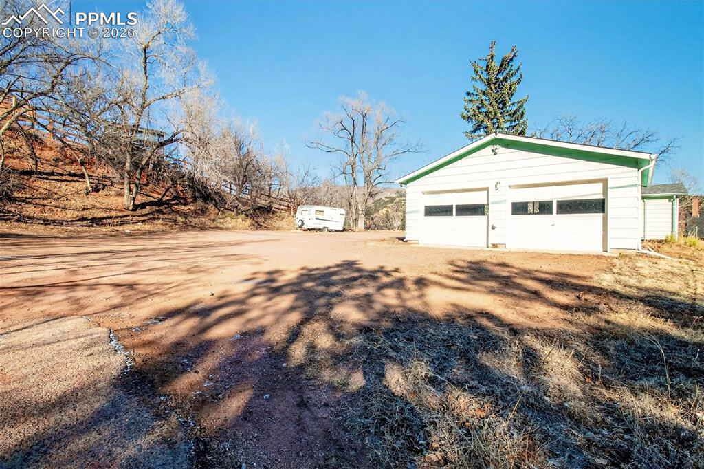 Image 37 of 37: Lot 2 (with oversized garage w/separate storage and workshop, and storage s