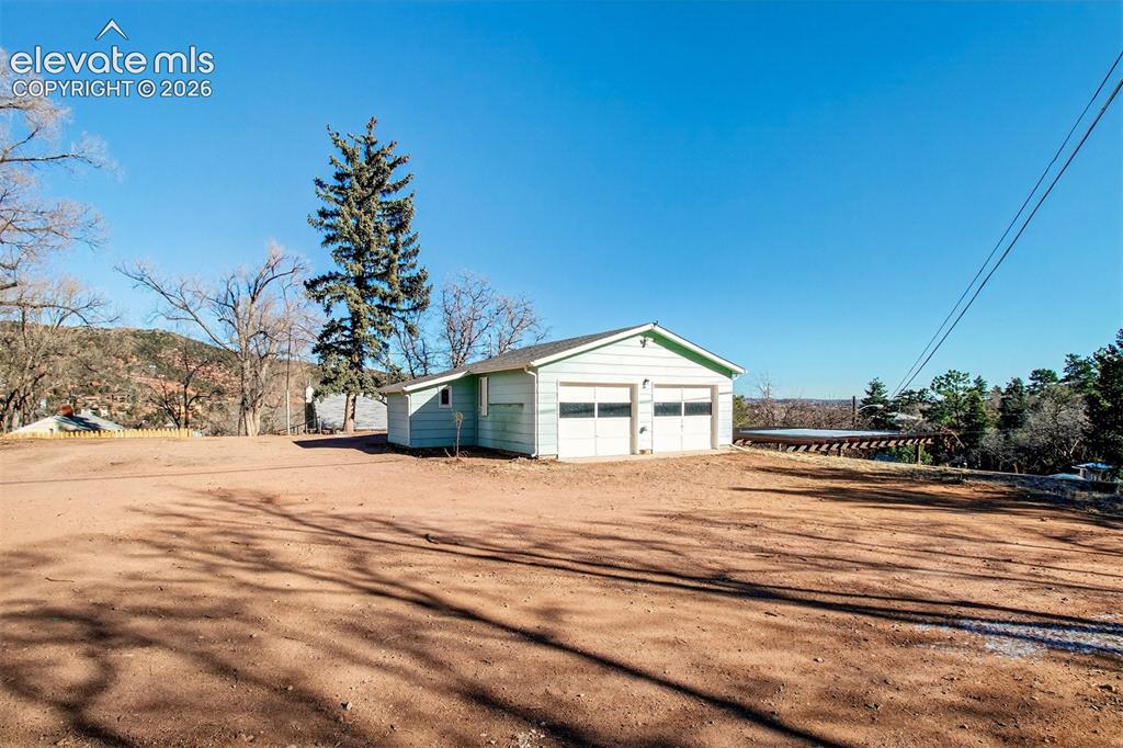Image 40 of 41: Lot 2 (with oversized garage w/separate storage, and storage shed) and buil