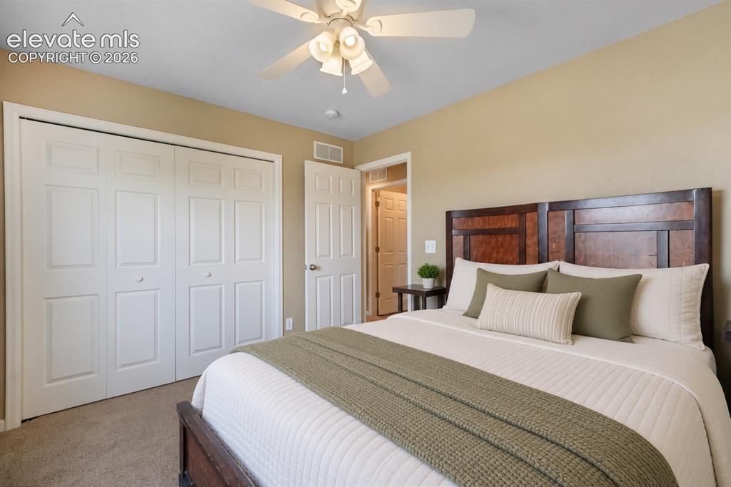 Image 29 of 49: Recessed lighting, ceiling fan with integrated lighting, paneled doors, and