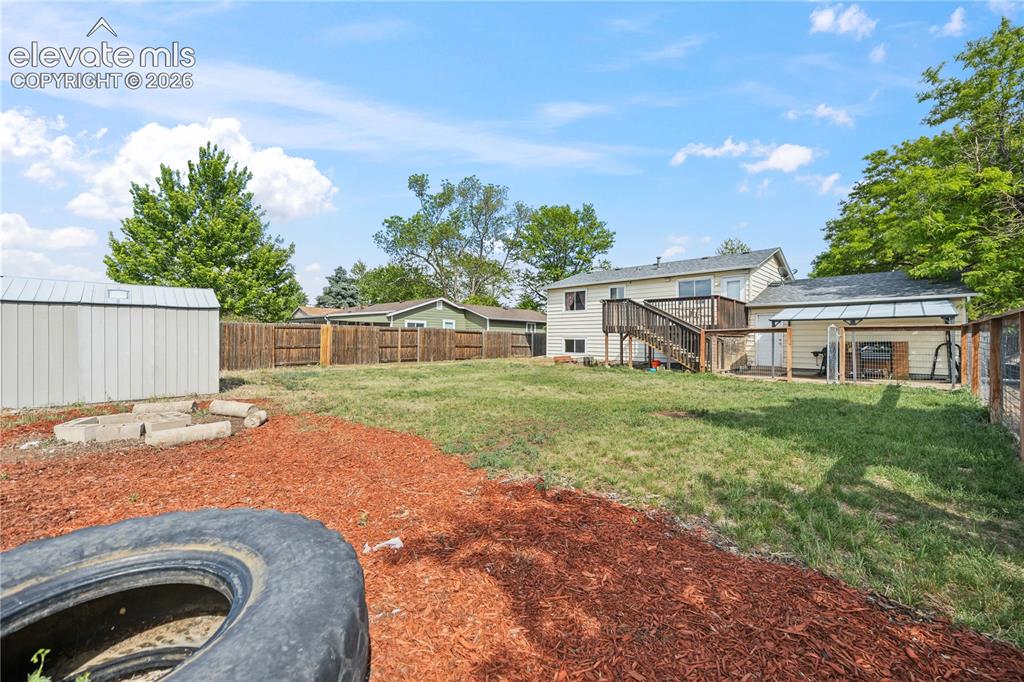 Image 29 of 31: Firepit area with log seating.