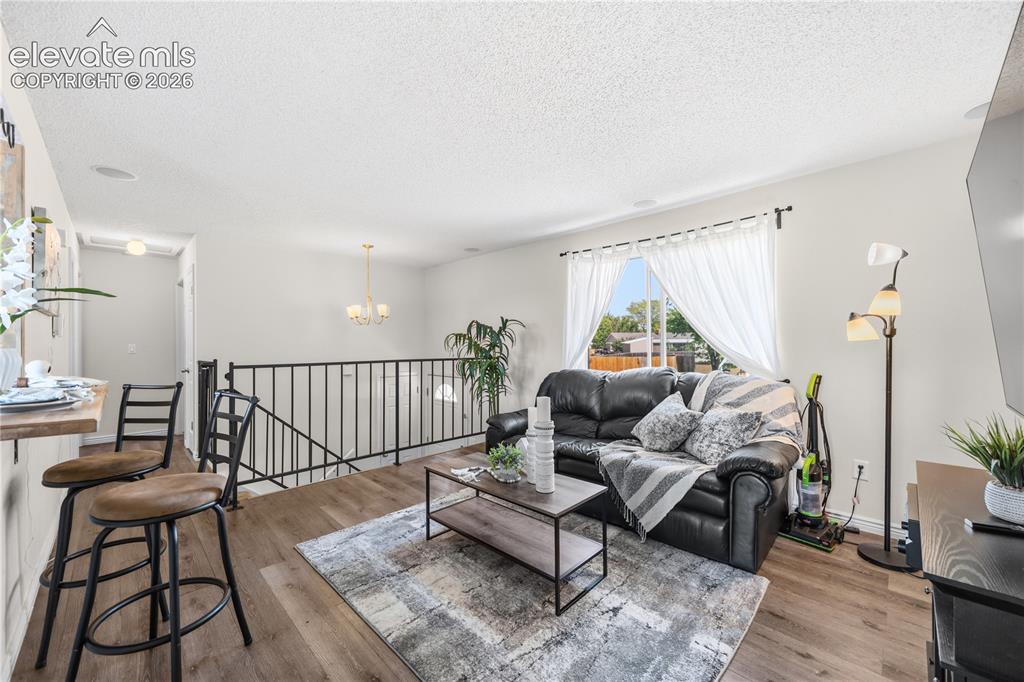 Image 5 of 31: The Living Room has a large front window that brings in lots of natural lig