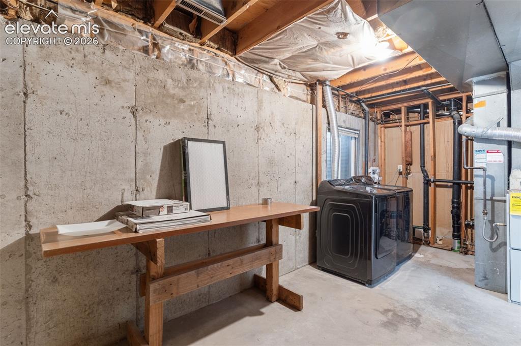 Image 24 of 31: Spacious laundry/utility room - good storage space!