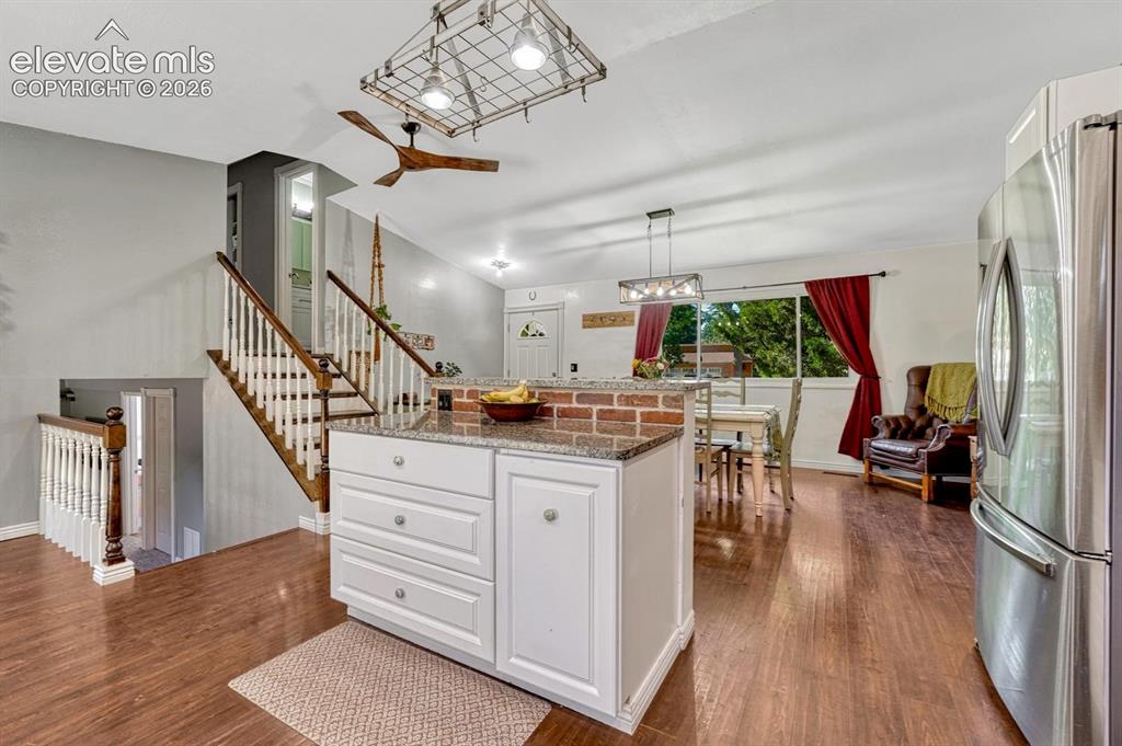 Image 10 of 50: View of the Dining Room and Front Entry from the Kitchen.
