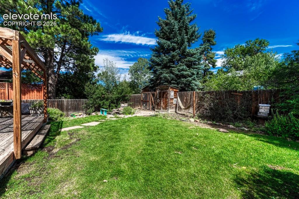 Image 39 of 50: Grass area for the kids and pets to play.