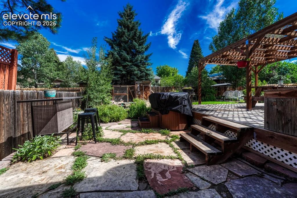 Image 42 of 50: Flagstone patio with bar area for entertaining.