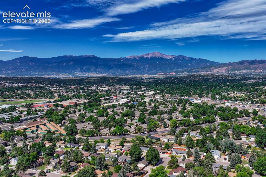 Image 47 of 50: Aerial view of neighborhood with fabulous mountain and Peak views!