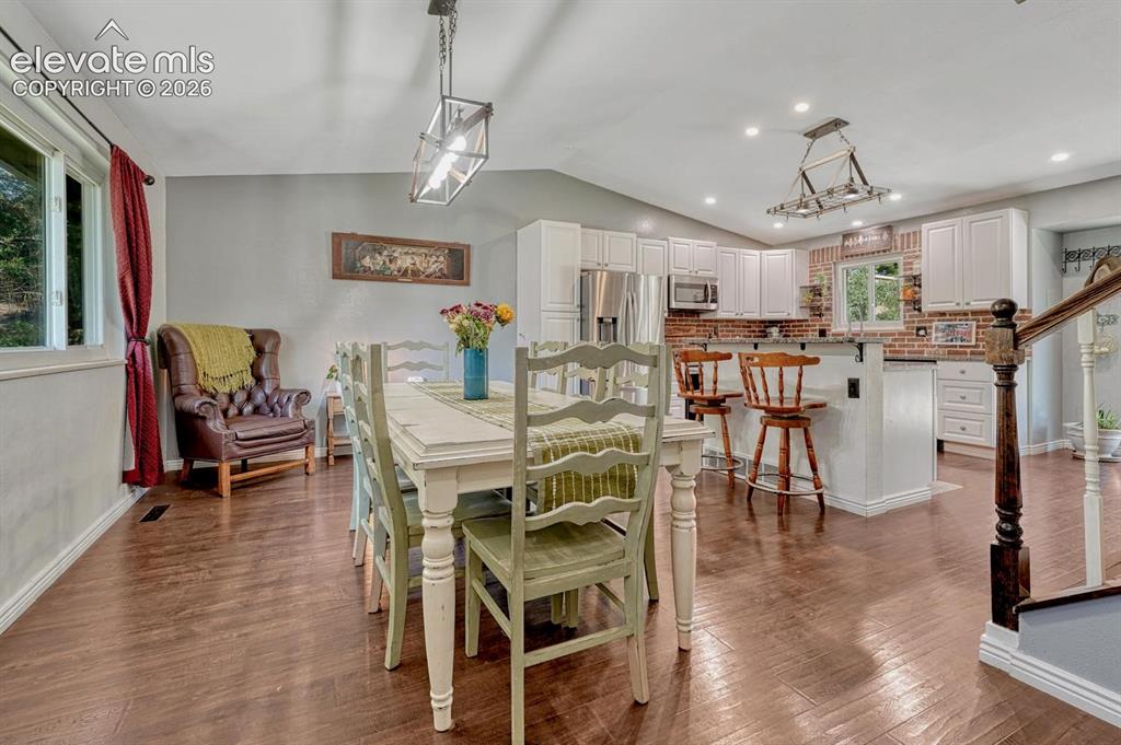 Image 5 of 50: Views of the Dining Room and updated Kitchen from the Front Entry.