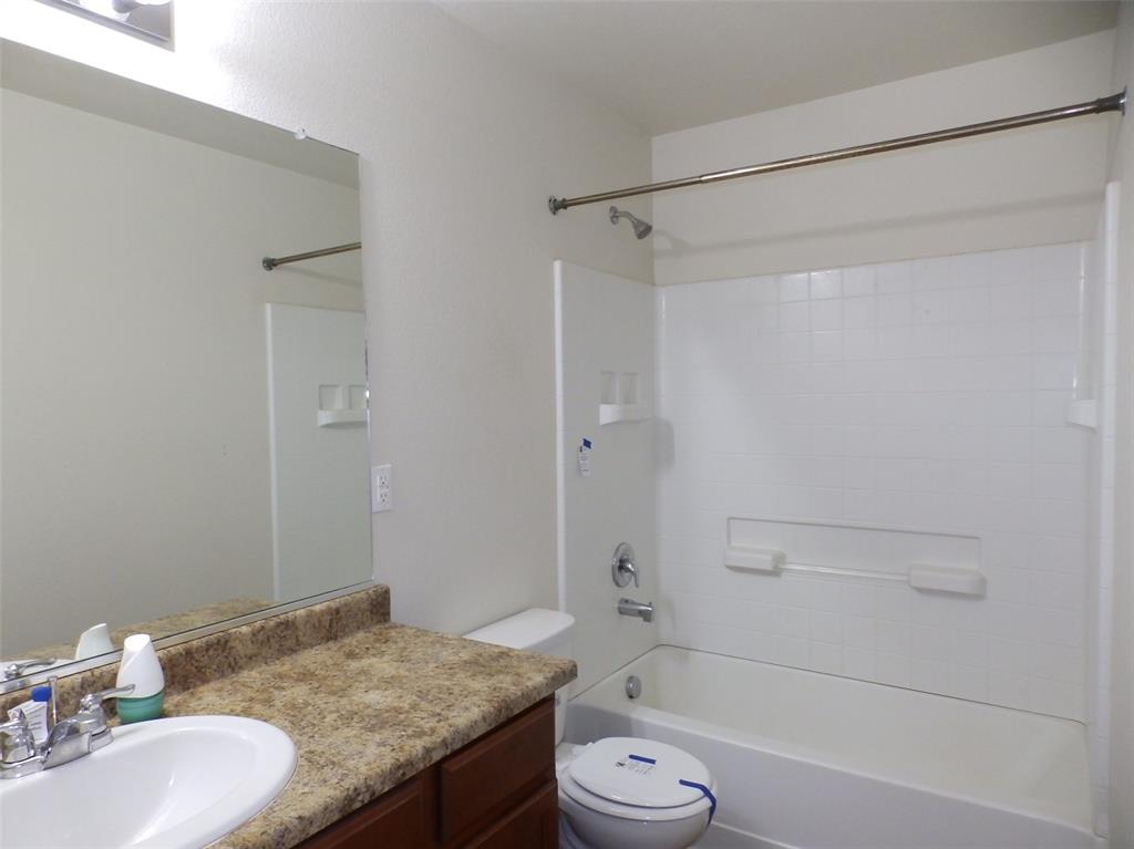 Image 12 of 16: Hall bath