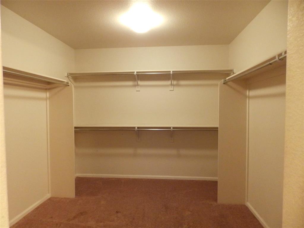 Image 8 of 16: Huge walk-in main closet