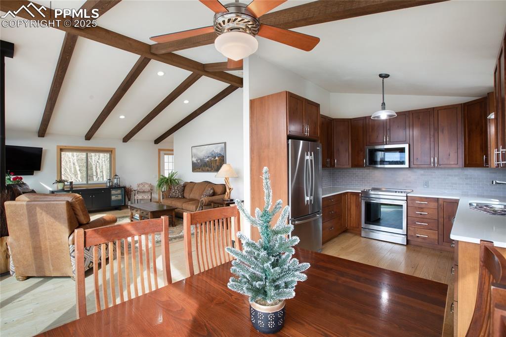 Image 16 of 40: Dining, Living and Kitchen combo =Trifecta