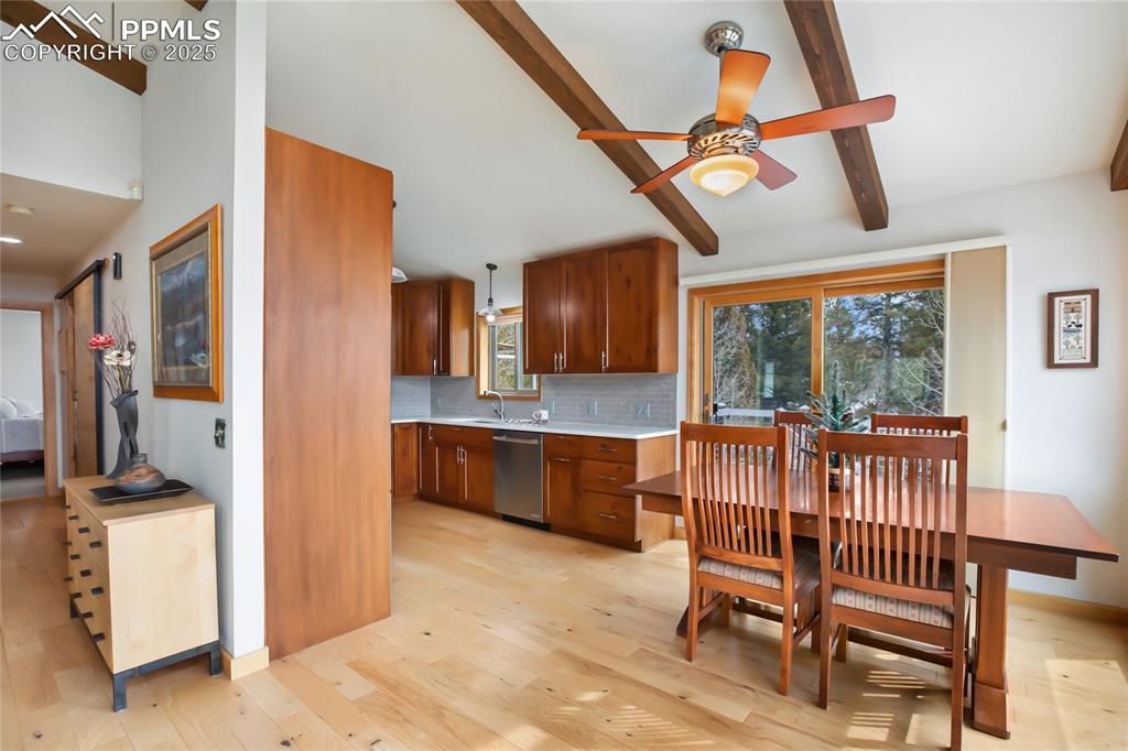 Image 17 of 40: Walk out from the dining area to enjoy a nightcap on the deck