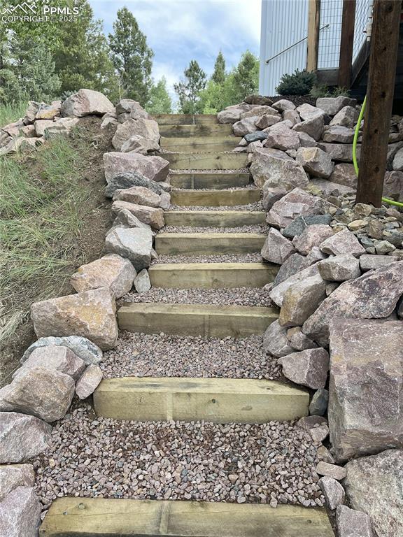 Image 34 of 40: Ready to take a walk around this beautiful home on these newly landscaped s