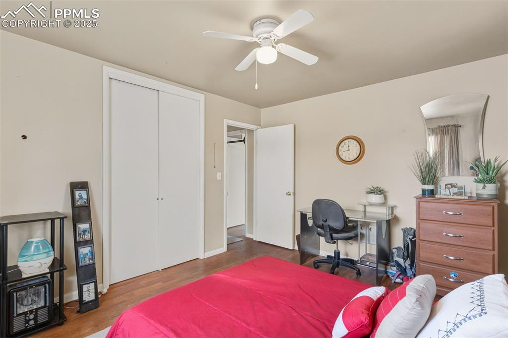 Image 19 of 37: Bedroom featuring a closet, wood finished floors, a ceiling fan, and an off