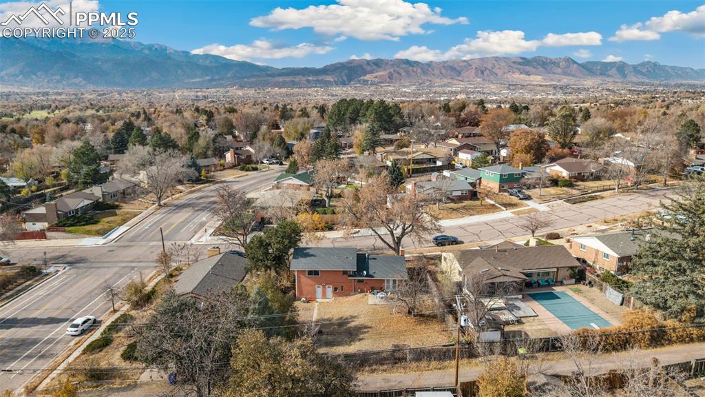 Image 35 of 37: Aerial perspective of suburban area with mountains