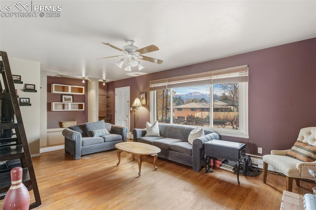 Image 7 of 37: Living area with wood finished floors