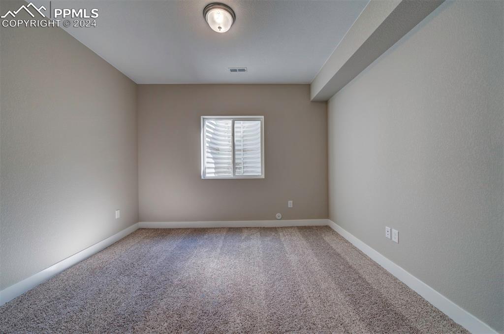 Image 25 of 47: View of carpeted spare room